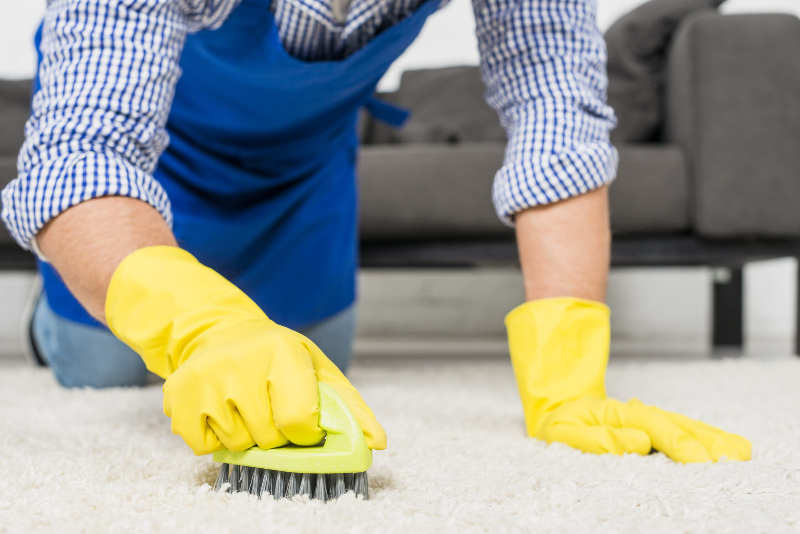 close-up-man-cleaning-his-house